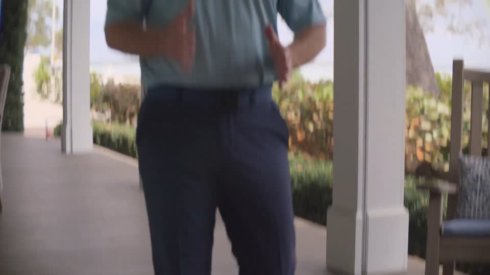 Feet walking on a porch deck